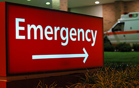 Emergency room sign with arrow outdoors
