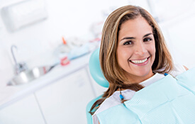 Young smiling woman in dental chair