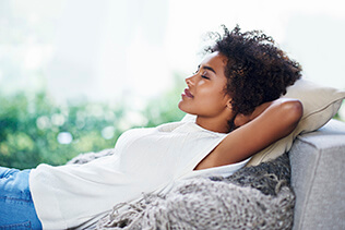 Woman relaxing on couch